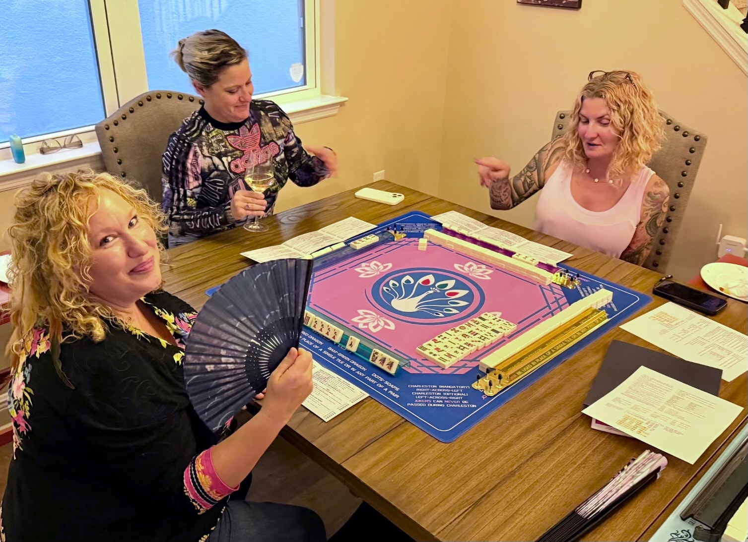 Friends gathered for a colorful Mahjong game